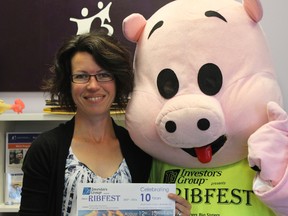 Arlene Coculuzzi, executive director for Big Brothers, Big Sisters, stands beside a mascot pig named Kris P. Bacon Tuesday afternoon at the Big Brothers and Big Sisters of Hastings and Prince Edward counties office. The organization is hosting it's 10th annual Ribfest at Zwicks park next month. Attendees will see Kris P. Bacon and its friend Ronnie Ribs during the weekends activities.
