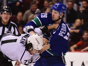 Los Angeles Kings forward Jordan Nolan and Vancouver Canucks defenseman Andrey Pedan fight during the first period at Rogers Arena. (Anne-Marie Sorvin-USA TODAY Sports)