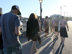 Soundwalk participants walk down Barrack Street at the start of the walk to listen to sounds of human activity in Kingston on Monday. (Julia Balakrishnan/For The Whig-Standard)