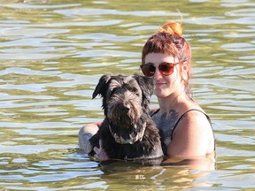 Meghan Lafontaine and Rush the dog cool off in Silver Lake in Sudbury, Ont. on Tuesday July 19, 2016. John Lappa/Sudbury Star/Postmedia Network