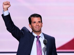 Donald Trump, Jr., son of Republican presidential candidate Donald Trump, lifts his fist after speaking during the second day of the Republican National Convention in Cleveland, Tuesday, July 19, 2016. (AP Photo/J. Scott Applewhite)