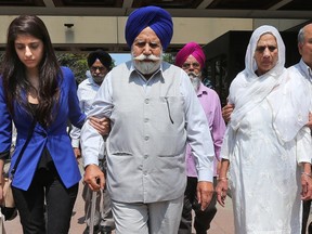 Jagtar's nice Ramandeep Chahal (blue), father Ajit Singh and mother Jagir Kaur leave the courthouse in Ottawa Wednesday July 20, 2016. Photo by Tony Caldwell