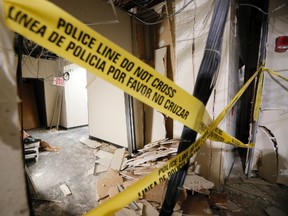 Damage from a blast is shown in a hallway at El Centro College downtown campus, Tuesday, July 19, 2016, in Dallas. According to officials, this is where gunman Micah Johnson was killed by the blast after he killed five police officers wounding several earlier this month during a protest. (AP Photo/Tony Gutierrez)