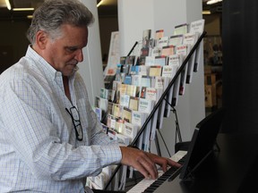 Samantha Reed/The Intelligencer
Pinnacle Music Studios owner Ken Harnden plays one of the pianos he has for sale at the pop-up shop Wednesday morning. Currently, eight Front Street businesses have set up at the pop-up shop, which was created to help downtown businesses during Phase 2 of the revitalization construction.