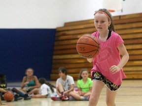 Terry Bridge/Sarnia Observer 
Brooke Zimmer, 11, from Sarnia dribbles a basketball at the St. Clair Mini-Colts summer camp on Wednesday. The camp runs all week at Sarnia Collegiate Institute and Technical School and returns for two more weeks in August.
