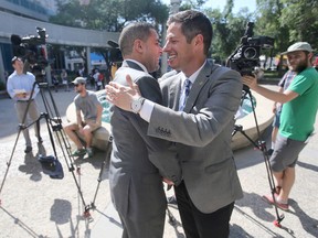 Winnipeg Mayor, Brian Bowman, today,  announced more money to fight homelessness in Winnipeg.  Bowman (right) is pictured here greeting Sachit Mehra, chair of Downtown Biz's safety Committee.  Wednesday, July 20, 2016.   Sun/Postmedia Network