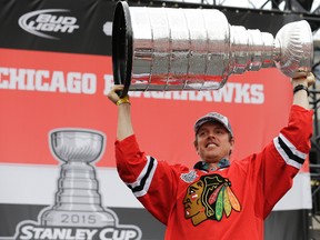 Brad Richards, seen here holding up the Stanley Cup during a rally at Soldier Field after the Blackhawks won in 2015, announced his retirement after 15 NHL seasons on Wednesday, July 20, 2016. (Nam Y. Huh/AP Photo/Files)