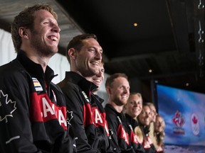 Members of the four teams to represent Canada in beach volleyball at the Rio Olympics (left to right Sam Schachter, Josh Binstock, Ben Saxton, Chaim Schalk, Kristina Valjas, Jamie Broder, Sarah Pavan and Heather Bansley) are pictured at the Canadian Olympic Committee's press availability for the athletes held in a Toronto restaurant on July 20, 2016. (THE CANADIAN PRESS/Chris Young)