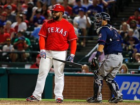 Rangers batter Prince Fielder stands by the plate as Twins catcher Kurt Suzuki returns the ball to pitcher Tyler Duffey following Fielder's strike out during sixth inning MLB action in Arlington, Texas, on July 7, 2016. (Tony Gutierrez/AP Photo)
