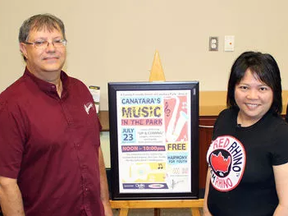 From left, musician Cynthia Fay, Harmony for Youth executive director Gerry Surette, and My Red Rhino TV owners Melanie and Richard Marhue showcase the poster for Canatara's Music in the Park on Tuesday June 14, 2016 in Point Edward, Ont. The 10-hour free-admission concert on July 23 will feature seven up-and-coming acts. (Terry Bridge, Sarnia Observer)