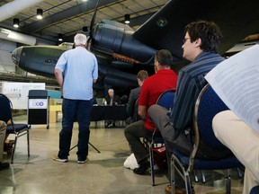 A citizen asks a question during a public forum on national defence at the National Air Force Museum of Canada in Trenton, Wednesday. It gave residents a chance to respond to questions about the future of Canada's military and defence policy.