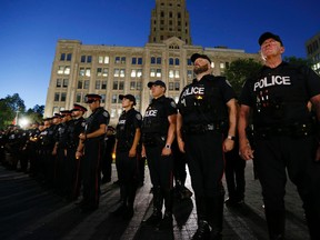 A candlelight vigil of Toronto Police for the fallen officers in the United States was held near Queen's Park in Toronto on July 20, 2016. (Stan Behal/Toronto Sun)