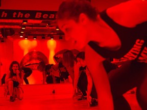In this Saturday, May 21, 2016 photo, Sadie Kurzban leads, left, the Cardio Arms class at 305 Fitness in New York. Kurzban, a hip-hop dance workout with a live DJ, says drill sergeant-style putdowns and body-shaming comments from instructors are ultimately counterproductive for clients, some of whom already have body insecurities.