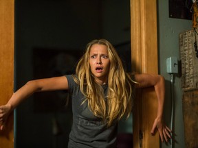 Teresa Palmer appears in a scene from the horror film, "Lights Out."