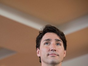 Canadian Prime Minister Justin Trudeau listens to a question as he speaks with the media following a child care benefit announcement Wednesday July 20, 2016 in Aylmer, Que. THE CANADIAN PRESS/Adrian Wyld