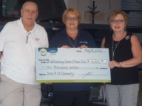 Progressive Ford's Terri Lynn Bechard, centre, presents a cheque to the Wallaceburg Senior Citizens Club's Skip Harvey and Jill VanZelst for $6,000 for taking part in their Drive 4 Ur Community event earlier this year. The event allows community groups and organizations to host the test drive event as fundraiser.