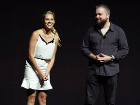 Teresa Palmer, left, a cast member in the upcoming film "Lights Out," and director David Sandberg introduce a clip from the film during the Warner Bros. presentation at CinemaCon 2016, the official convention of the National Association of Theatre Owners (NATO), at Caesars Palace on Tuesday, April 12, 2016, in Las Vegas. (Photo by Chris Pizzello/Invision/AP)