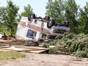A tornado touched down near Long Plain First Nation on Wednesday night, causing damage to trees, vehicles and structures. (Mickey Dumont/Postmedia Network)