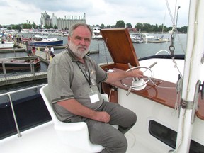 Scott Young, of Chatham, sits at the wheel of his boat at the 2014 Antique and Classic Boat Show at Sarnia Bay Marina. This year's boat show runs Saturday, 9 a.m. to 4 p.m., at the marina. (File photo/THE OBSERVER)