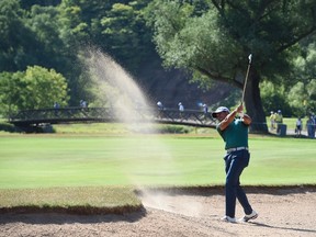 Jason Day of Australia hits out of a bunker on the 14th hole of the first round at the Canadian open at Glen Abbey in Oakville, Ont., on Thursday, July 21, 2016. (Frank Gunn/The Canadian Press)