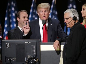 Republican presidential candidate Donald Trump (2nd L) and his daughter Ivanka Trump (R) test the teleprompters and microphones on stage before the start of the fourth day of the Republican National Convention on July 21, 2016 at the Quicken Loans Arena in Cleveland, Ohio. (Photo by Chip Somodevilla/Getty Images)