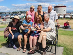 Dedicated members of the Canadian Diabetes Association, (from left) Kristen Kimball-Evans, Mike Nimeh, Betsy Lake, Mel Viner, Donald Mann (back from right) and Tammy Selena Tuck, along with Deanna Davies of Boys and Girls Club Kingston, got a taste test of Tir Nan Og’s beet hummus dish on Tuesday July 19, 2016 in Confederation Park. The dish will be served as part of the Taste of Kingston event on Sunday in the park. (Jane Willsie/For The Whig-Standard)