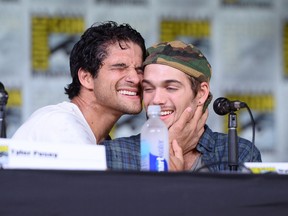 Actor Tyler Posey (L) after pouring a bottle of water on himself next to actor Dylan Sprayberry during the "Teen Wolf" panel during Comic-Con International 2016 at San Diego Convention Center on July 21, 2016 in San Diego, California.  (Photo by Matt Winkelmeyer/Getty Images)