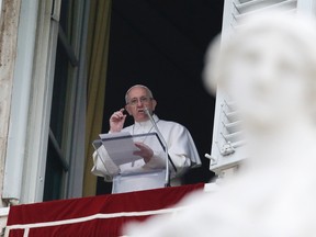 Pope Francis delivers the Regina Coeli prayer from his studio's window overlooking St. Peter's Square, at the Vatican, Monday, March 28, 2106. The pontiff is decrying what he calls the ‘’vile’’ and ‘’abominable’’ Easter Sunday bombing in a Pakistani park targeting Christians and insisting religious minorities be protected. (AP Photo/Gregorio Borgia)