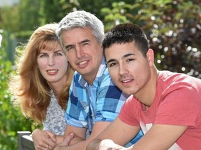 Jesse Downing, 21, was adopted at age 18 by Rob and Jennifer Bouma who heard him speak about being a longterm foster child in Edmonton, Friday, July 8, 2016. Ed Kaiser/Postmedia