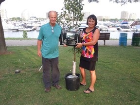 More than $6,200 was raised for the Lambton Tree Legacy program through the annual Warden's Charity Picnic held at the Sarnia Bay Marina Thursday. The tree legacy program was kicked off earlier this year with the planting of sugar maple and oak trees in Oil Springs in honour of Cindy Aimers, a long-time friend of Warden Bev MacDougall's family. Pictured here is Bill Aimers, husband of the late Cindy Aimers, with MacDougall. Handout/Sarnia Observer/Postmedia Network