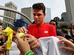 Canadian tennis star Milos Raonic signs autographs for fans in Toronto on July 21, 2016. (Stan Behal/Toronto Sun/Postmedia Network)