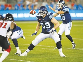 Josh Bourke drops into pass- protection mode as QB Ricky Ray takes the snap out of the shotgun formation last week against the Redblacks. (Argonauts photo)