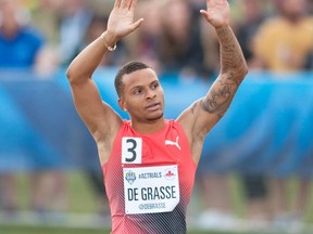 Andre De Grasse reacts after winning the men's 100-metre final at the Canadian Track and Field Championships and Selection Trials for the Olympic and Paralympic Games in Edmonton on July 9, 2016. (THE CANADIAN PRESS/Dan Riedlhuber)