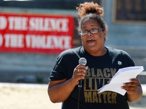 Peterborough resident Elizabeth Jenkins, speaks about negative experiences she has had to face because of the colour of her skin to over 100 people attending a Black Lives Matter rally on Friday July 22, 2016 at Confederation Square in Peterborough, Ont. (Clifford Skarstedt/Peterborough Examiner/Postmedia Network)