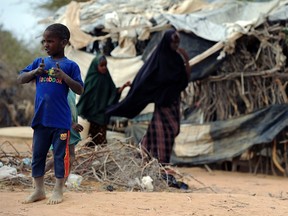 A young boy looks on at Kenya's sprawling Dadaab refugee complex during a visit of Pakistani activist for female education and the youngest-ever Nobel Prize laureate Malala Yousafzai organised by the UN High Commissioner for Refugees, in Garissa on July 12, 2016. / AFP PHOTO / TONY KARUMBATONY KARUMBA/AFP/Getty Images