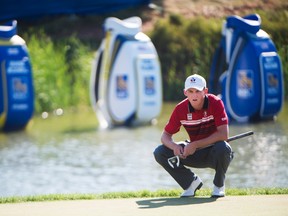 Jared du Toit of Canada line up his birdie putt on 18 at the Canadian Open in Oakville, Ont., on July 22, 2016. (THE CANADIAN PRESS/Nathan Denette)