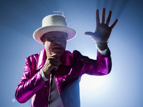 The Tragically Hip's Gord Downie, performs during the first stop of the Man Machine Poem Tour at the Save-On-Foods Memorial Centre in Victoria, B.C., Friday, July 22, 2016. Gerry Kahrmann/Postmedia
