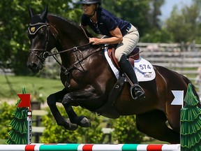 Olympian Amy Millar competes with her horse Paris at Wesley Clover in Ottawa on Thursday July 21, 2016. Errol McGihon/Postmedia