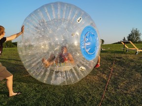 Brothers Derek and Greg McKnight, seen here at Garbage Hill recently, are bringing the thrill ride of zorbing to Winnipeg.