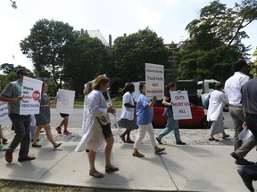The group Concerned Ontario Doctors held a rally protesting closed door negotiations between government and Ontario Medical Association on Friday July 22, 2016. Jack Boland/Toronto Sun/Postmedia Network