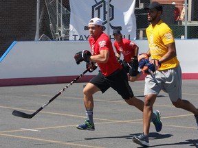 Taylor Hall looks to get to the ball before Darnell Nurse during their first game at the third annual Taylor Hall Charity Ball Hockey Tournament in support of the Boys and Girls Club of Kingston and Area in Kingston, Ont. on Saturday July 23, 2016. Steph Crosier/Kingston Whig-Standard/Postmedia Network