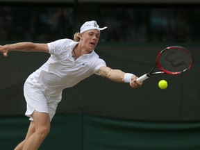 Denis Shapovalov plays a return during the boys' singles final at Wimbledon in London on July 10, 2016. (Tim Ireland/AP Photo)