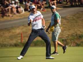 Jared du Toit reacts after sinking an eagle on 18 at the 2016 Canadian Open in Oakville, Ont., on Saturday, July 23, 2016. (Nathan Denette/The Canadian Press)