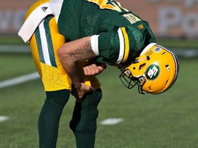 Edmonton Eskimos quarterback Mike Reilly reacts after being sacked by the Hamilton Tiger-Cats during second half CFL action in Edmonton, Alta., on Saturday July 23, 2016. The Eskimos squandered a 25-point lead in a 37-31 loss.