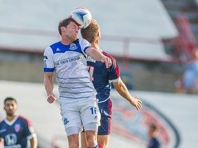 FC Edmonton midfielder Daryl Fordyce challenges for the ball against Indy Eleven midfielder Brad Ring in NASL play on Sunday in Indianapolis. The Indy Eleven won the game 1-0.