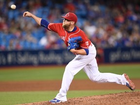 Toronto Blue Jays pitcher Drew Storen pitches against the Cleveland Indians during fifteenth inning MLB baseball action, in Toronto on Friday, July 1, 2016. THE CANADIAN PRESS/Frank Gunn