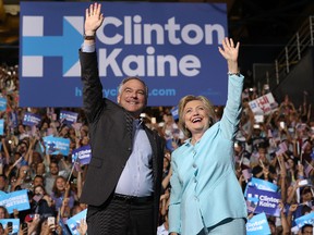 Democratic presidential candidate former Secretary of State Hillary Clinton and Democratic vice presidential candidate U.S. Sen. Tim Kaine (D-VA) greet supporters during a campaign rally at Florida International University Panther Arena on July 23, 2016 in Miami, Florida. (Photo by Justin Sullivan/Getty Images)