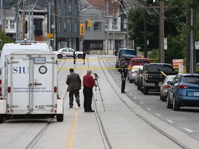 SIU on scene of a double shooting on Howard Park Ave. Sunday, July 24. (Jack Boland/Toronto Sun)