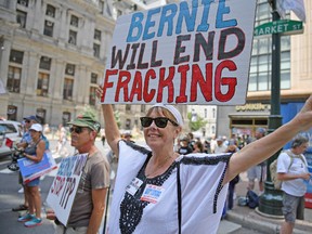 Activist including hundreds of environmentalists and Bernie Sanders supporters march through downtown before the start of the Democratic National Convention (DNC) on July 24, 2016 in Philadelphia, Pennsylvania. The convention officially begins on Monday and is expected to attract thousands of protesters, members of the media and Democratic delegates to the City of Brotherly Love.  (Photo by Jeff J Mitchell/Getty Images)