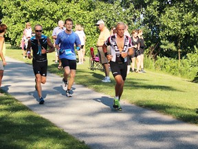 Runners in the Bluewater Triathlon beat the temperature challenge during Saturday's event in Bright's Grove. (Neil Bowen/Sarnia Observer)